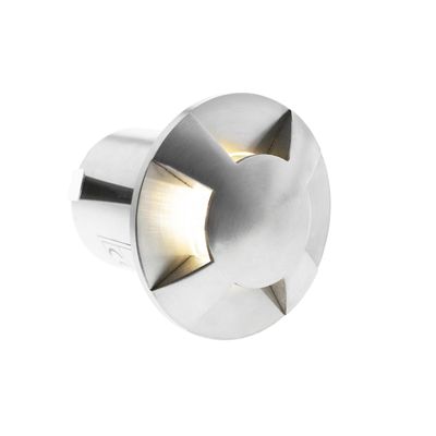 Recessed silver coloured metal LED step light with a round cross-shaped cover that emits a warm glow. Perfect for stylish, energy efficient lighting solutions.