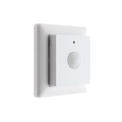 "White motion sensor with square wall plate for controlling LED lighting against a flat background.