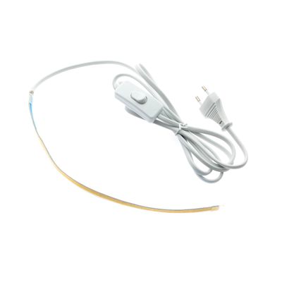 White LED strip light with plug-in cable and switch, ideal for energy efficient lighting solutions against a white background.