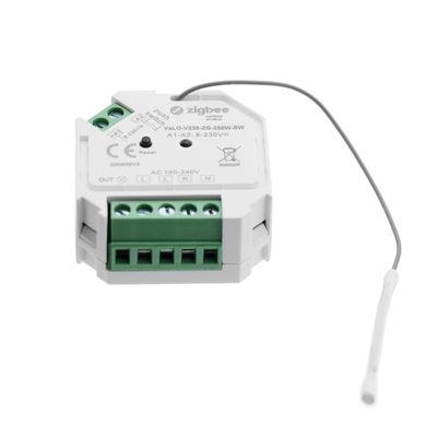 White Zigbee smart switch, green connectors, technical data sticker, white antenna wire on the side for LED lighting control.