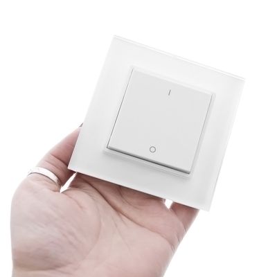 A sleek, minimalist white rectangular light switch from LED Lighting for modern interiors.