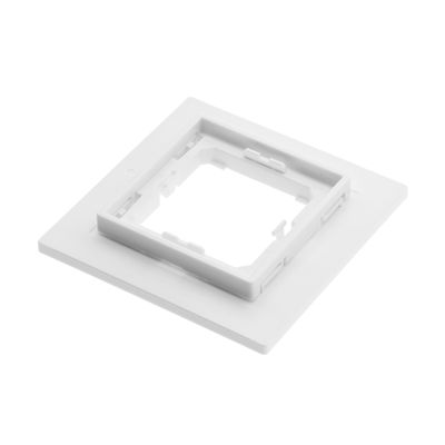 Alternative text: white square plastic LED light frame with cut-outs in the middle on a flat background, ideal for modern lighting solutions and minimalist design.