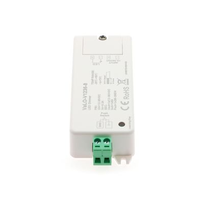 LED controller with green line connector displaying input/output data and compliance labels, ideal for improving energy efficient lighting settings.