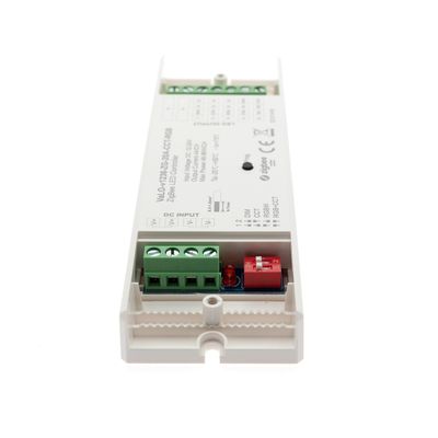 Alternative text: 'Rectangular white electronic LED lighting fixture with green and red connectors and technical information on the surface.