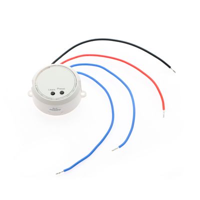 White controller with black, red, blue wires and buttons marked "Learn" and "Preset" for LED lighting systems.