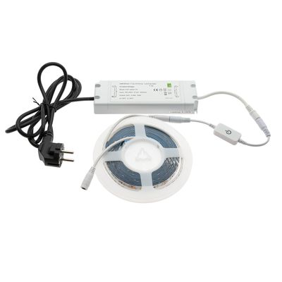 A twisted LED strip light set with power supply, dimmer and plug on a white background; ideal for customizable home lighting.