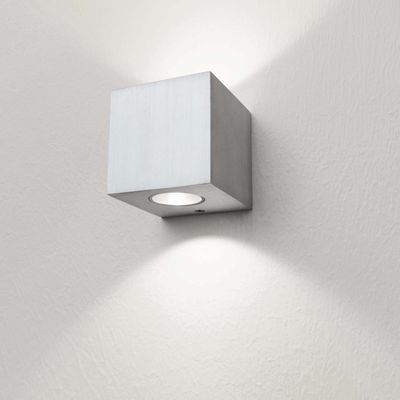 Alternative text: "Modern square LED wall light with textured white wall, softly illuminates upwards and downwards.