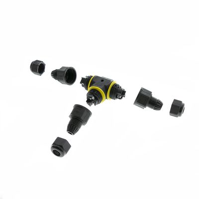 Disassembled black and yellow plastic tube connectors and fittings with white background, ideal for LED lighting installations.