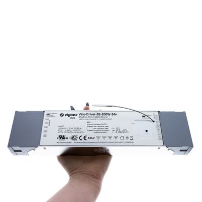 The Zigbee Varo-Driver ZG-200W-24v is a rectangular handheld Zigbee with visible labels for improved smart lighting connectivity in LED installations.