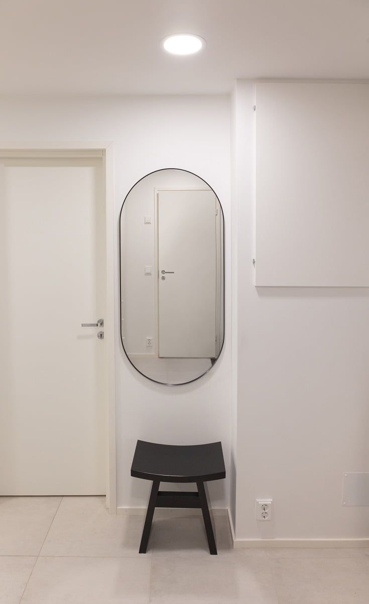A flush-mounted ceiling fan provides just the right amount of light in front of the mirror. ©LedStore