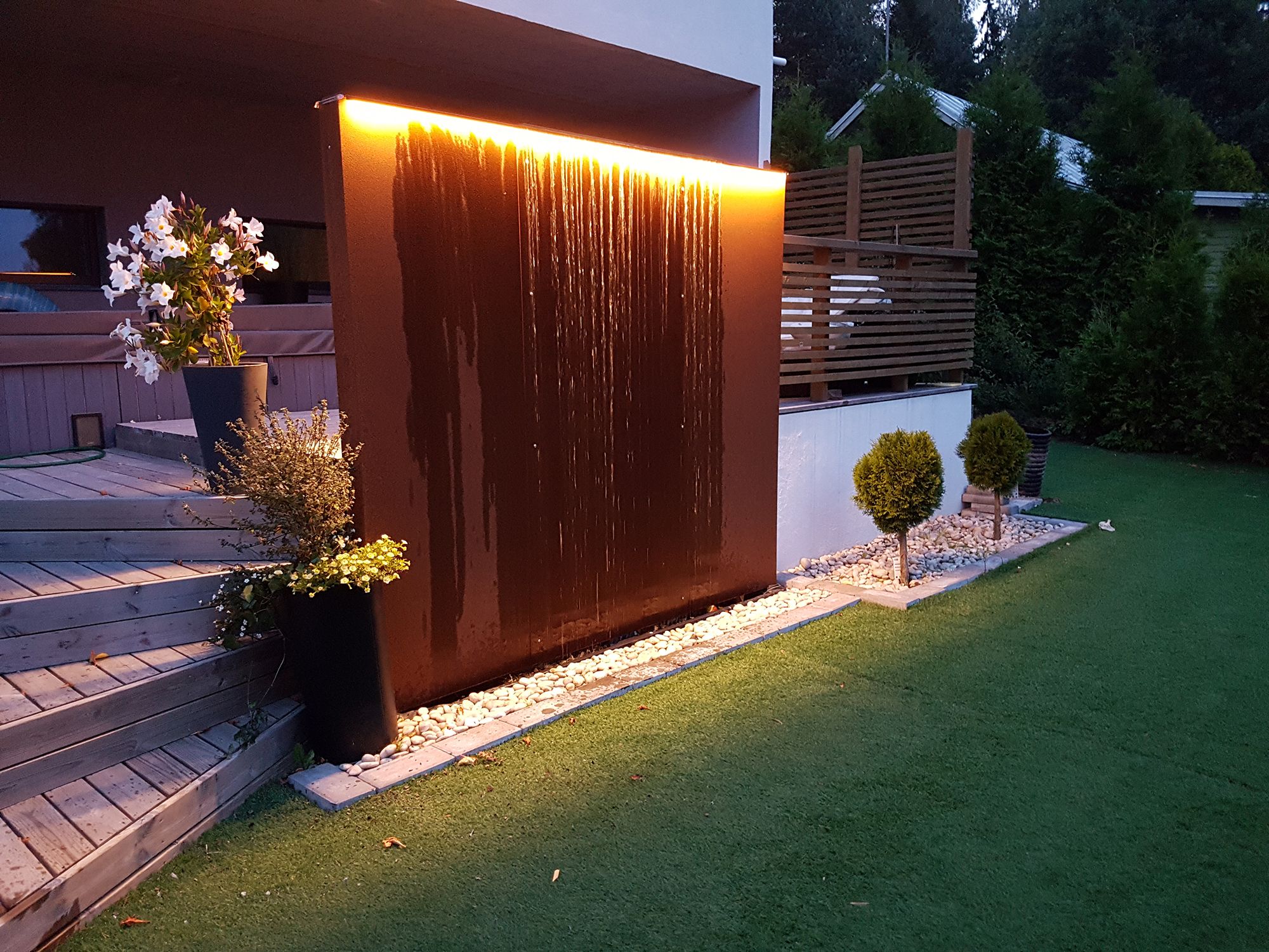 Water element accent with LED strip, also indirectly illuminates the courtyard. Ledstore.fi