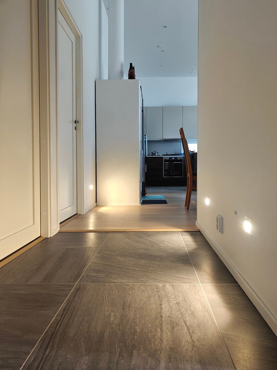 KULKIJA wall luminaires recessed in the lower part of the wall.