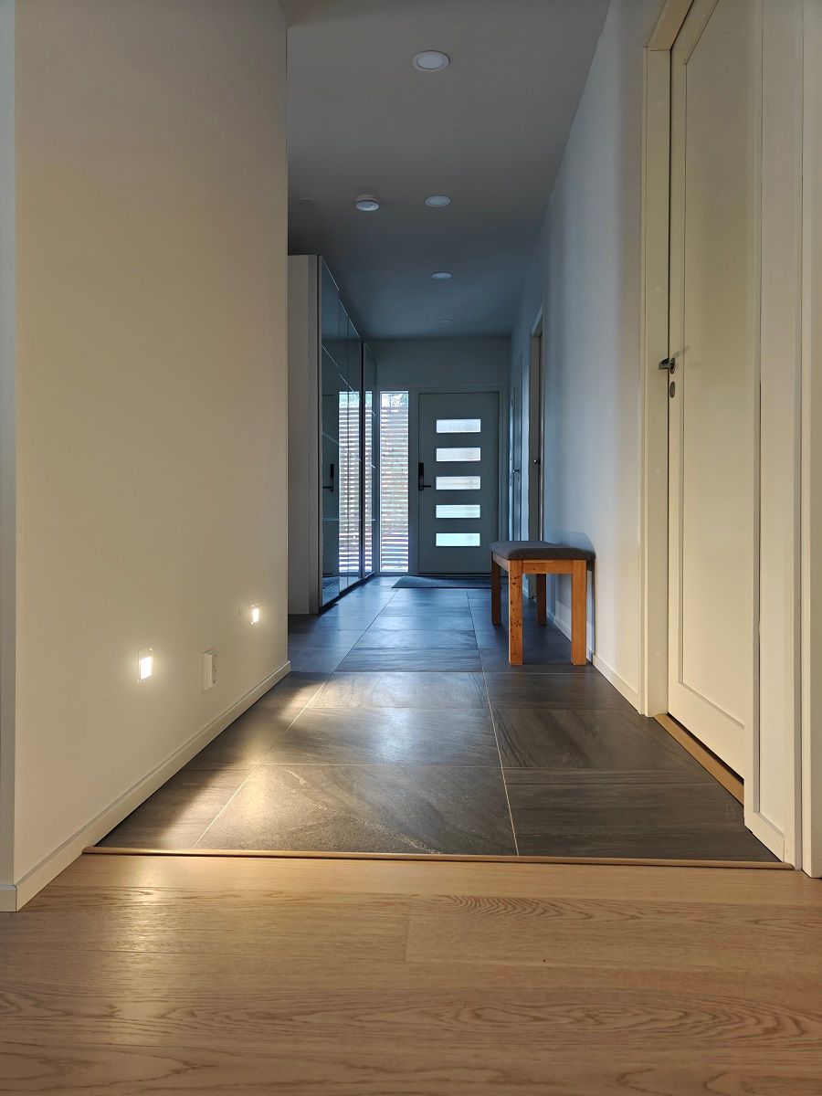 KULKIJA wall luminaires recessed in the lower part of the wall.