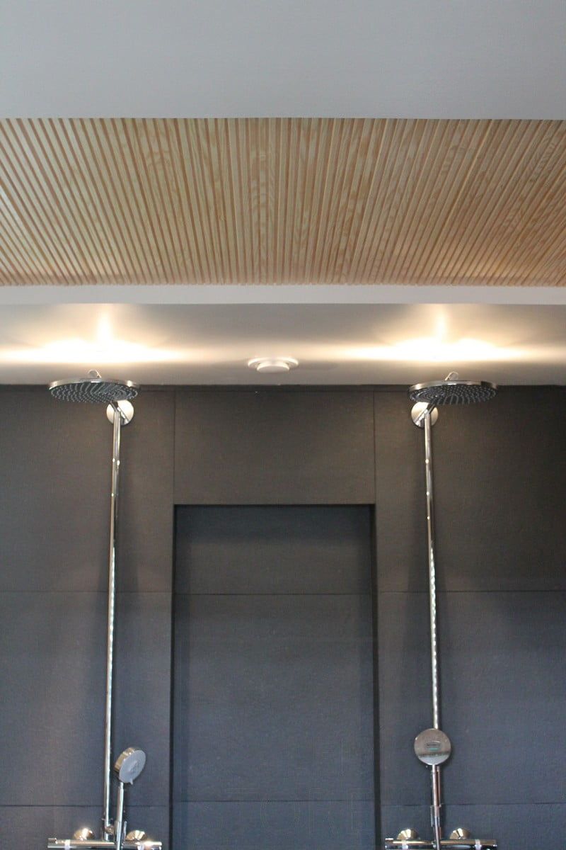 Housing Fair 2014: led spots on the showers in the washroom. The light is reflected on the ceiling. Ledstore.fi