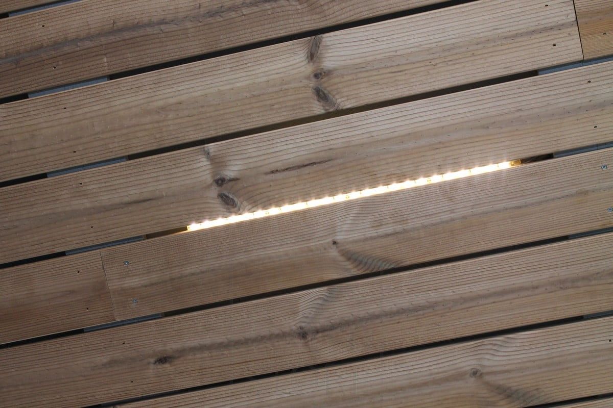 Housing Fair 2014: pieces of Led strip above a slit in the slab, close-up. Ledstore.fi