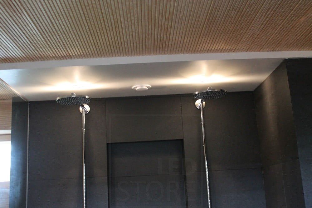 Housing Fair 2014: led spots on showers. The light is reflected on the ceiling. Ledstore.fi