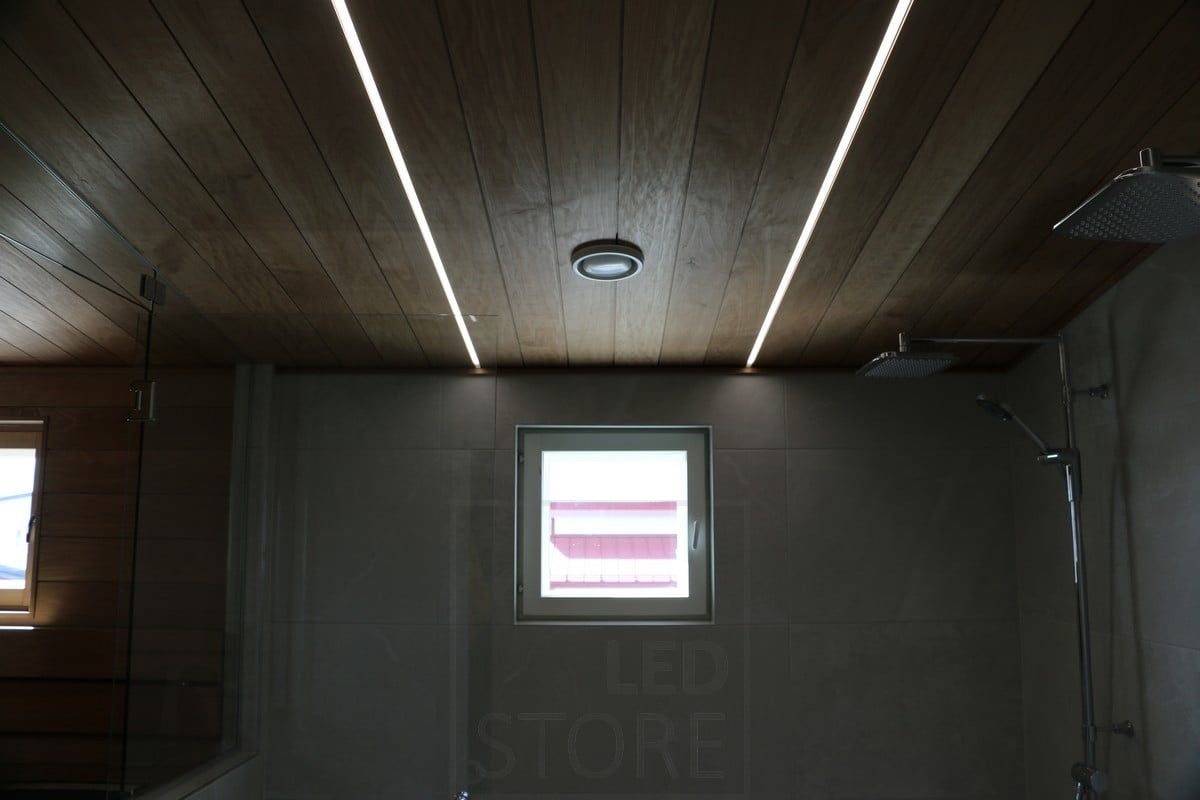 Housing Fair 2018: two narrow, low flush profiles embedded in the ceiling of the washroom. Ledstore.fi