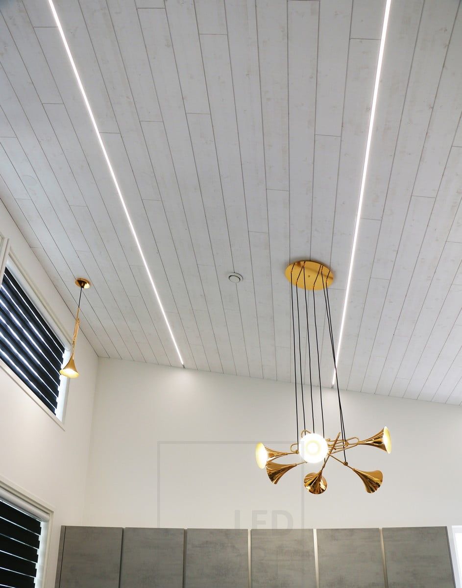 Housing Fair 2018: led pfofilfiles in the seams of ceiling tiles in a high living room. Ledstore.fi