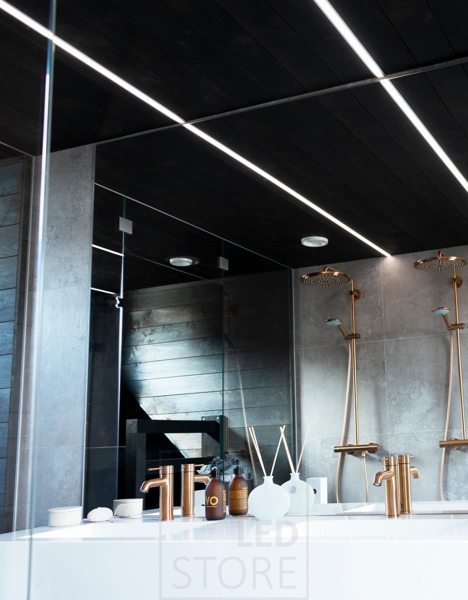 Housing Fair 2020: narrow flush-mounted profiles in the black ceiling of the washroom. Ledstore.fi