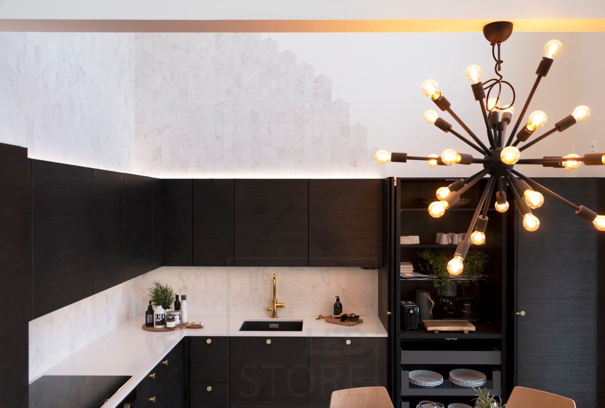 Housing Fair 2020: unharsh light on a black kitchen cabinet. Ledstore.fi