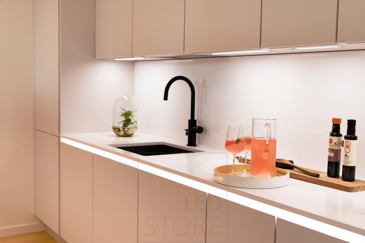 Housing Fair 2020: kitchen countertop lights in sections, embedded in the bottom of the cabinets. Another led strip illuminating the under-level indirect light. Ledstore.fi