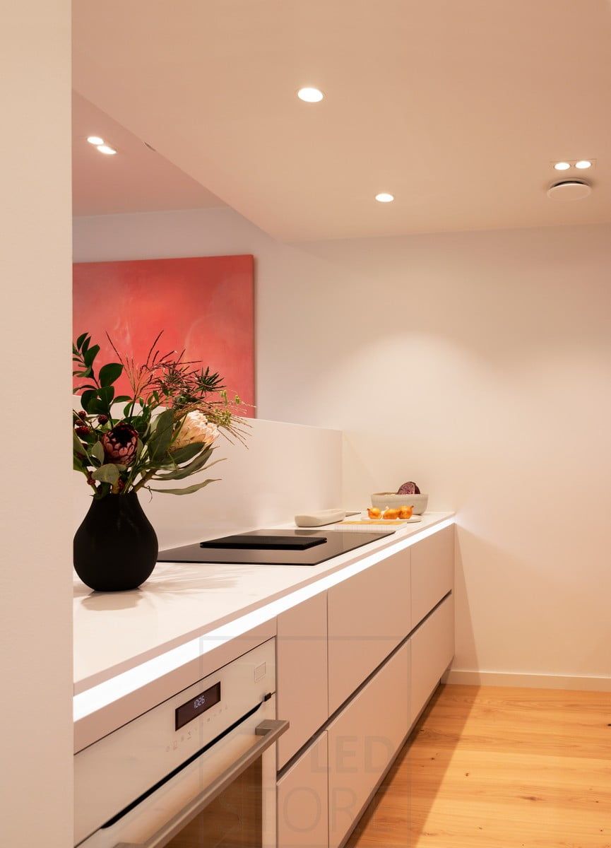 Housing Fair 2020: led profile at the bottom of the kitchen worktop illuminating indirect light. Spotlights as general lighting. Ledstore.fi