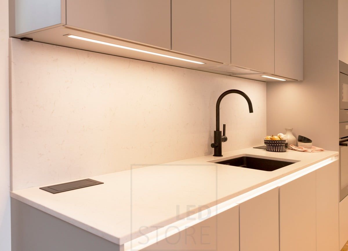 Housing Fair 2020: the kitchen worktop illuminated by LED strips embedded in the bottom of the cabinets. In addition, an LED strip under the level illuminates the indirect light. Ledstore.fi