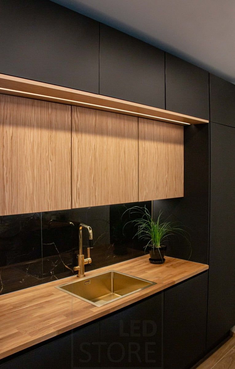 Housing Fair 2022: Kitchen upper cabinets on two levels, both levels illuminated by LED strip lighting. Ledstore.fi