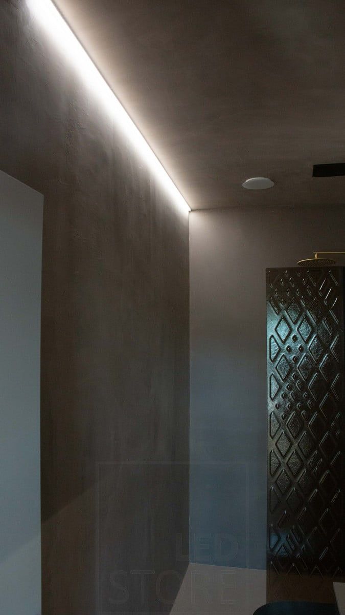 Housing Fair 2022: In the washroom, an LED strip provides mood lighting and highlights the texture of the wall. Ledstore.fi