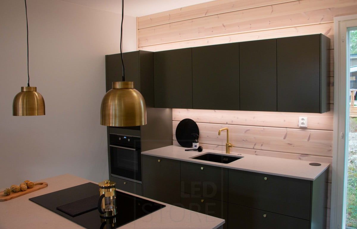 Indirect light in a black kitchen, from the side. Ledstore.fi