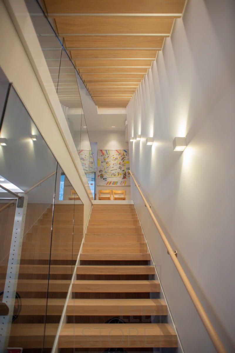 CUBIC led wall lights illuminating and accentuating through the wall in two directions. Ledstore.fi