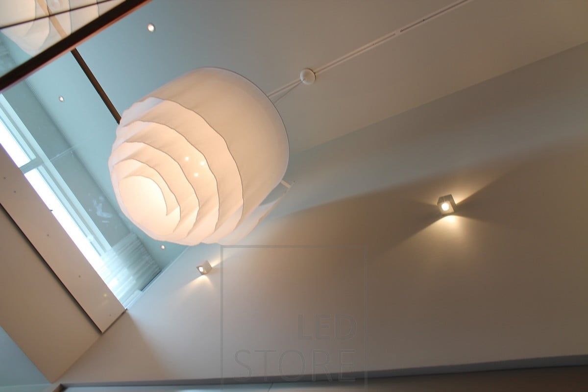 CUBIC led wall lamp with two directions illuminating the light between the floors. Ledstore.fi