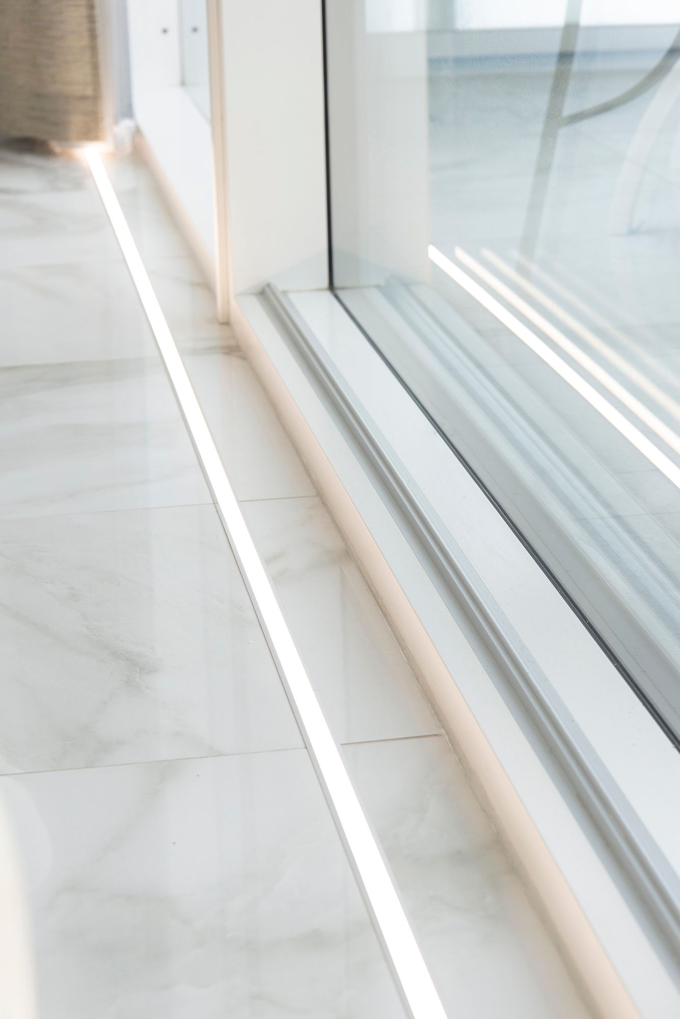 In front of the windows on the floor in the uppoprofile led strip. The lighting highlights the large windows and the beautiful marble floor. Ledstore.fi