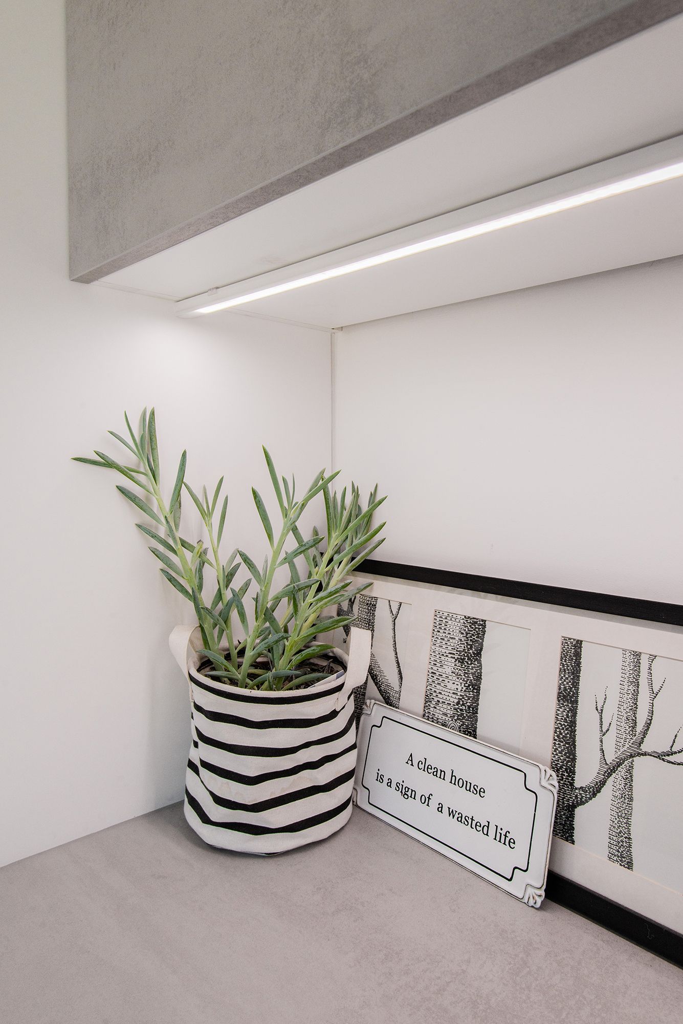 In the utility room, a LED strip mounted on a surface profile provides working light on the worktop. Ledstore.fi