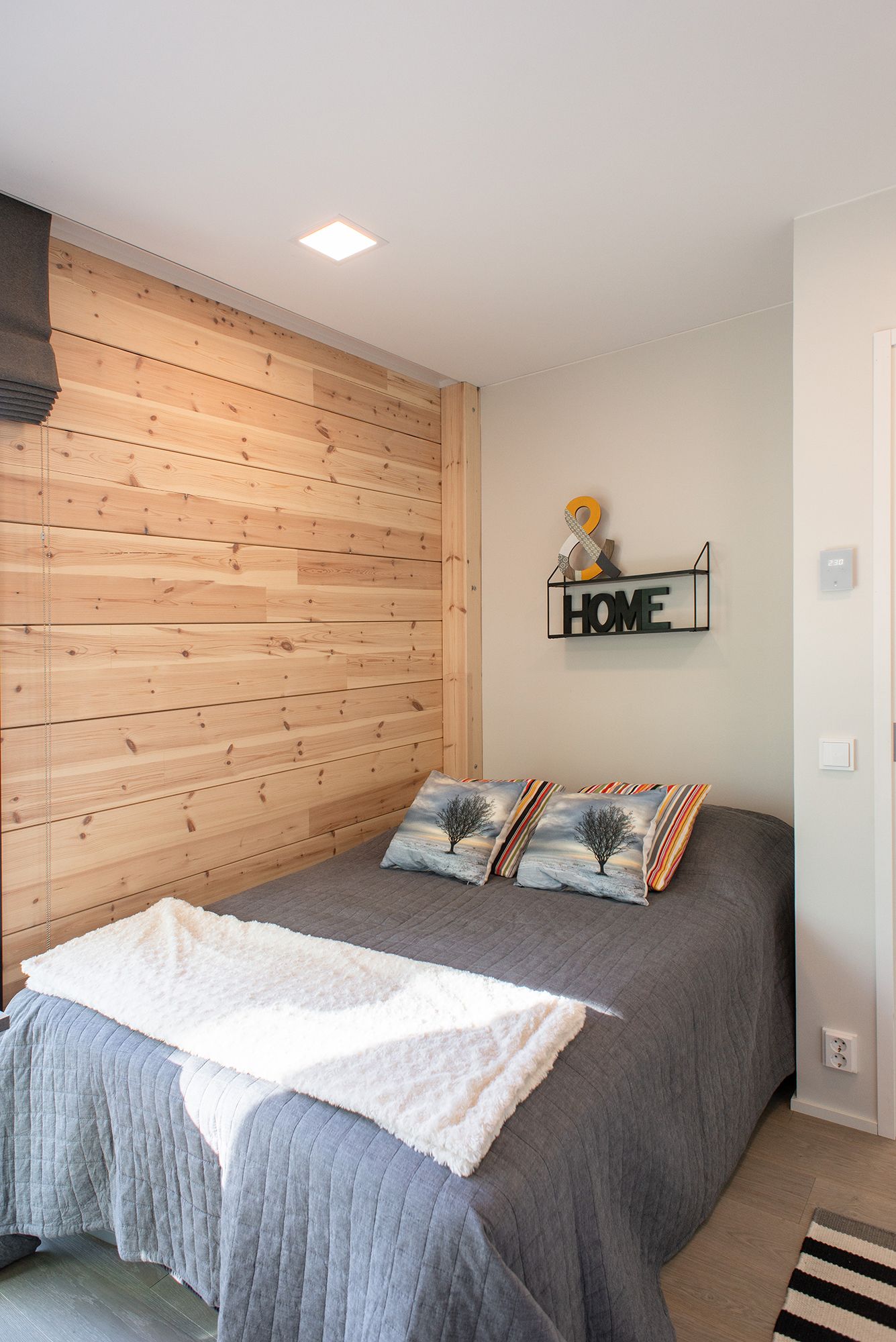 In the bedroom, panel lights on the ceiling for uniform general lighting. Ledstore.fi