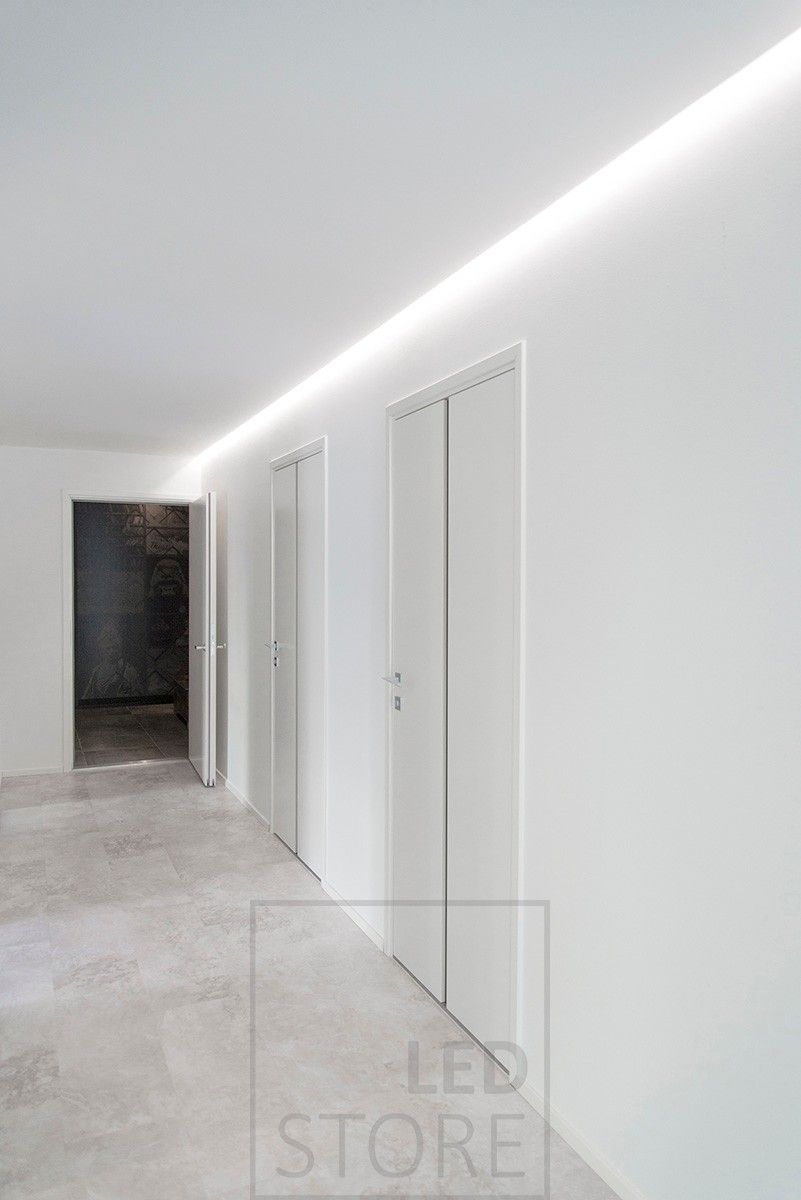 Beautiful lighting of a corridor with indirect light, LED strip installed in the groove between the ceiling and the wall. Ledstore.fi