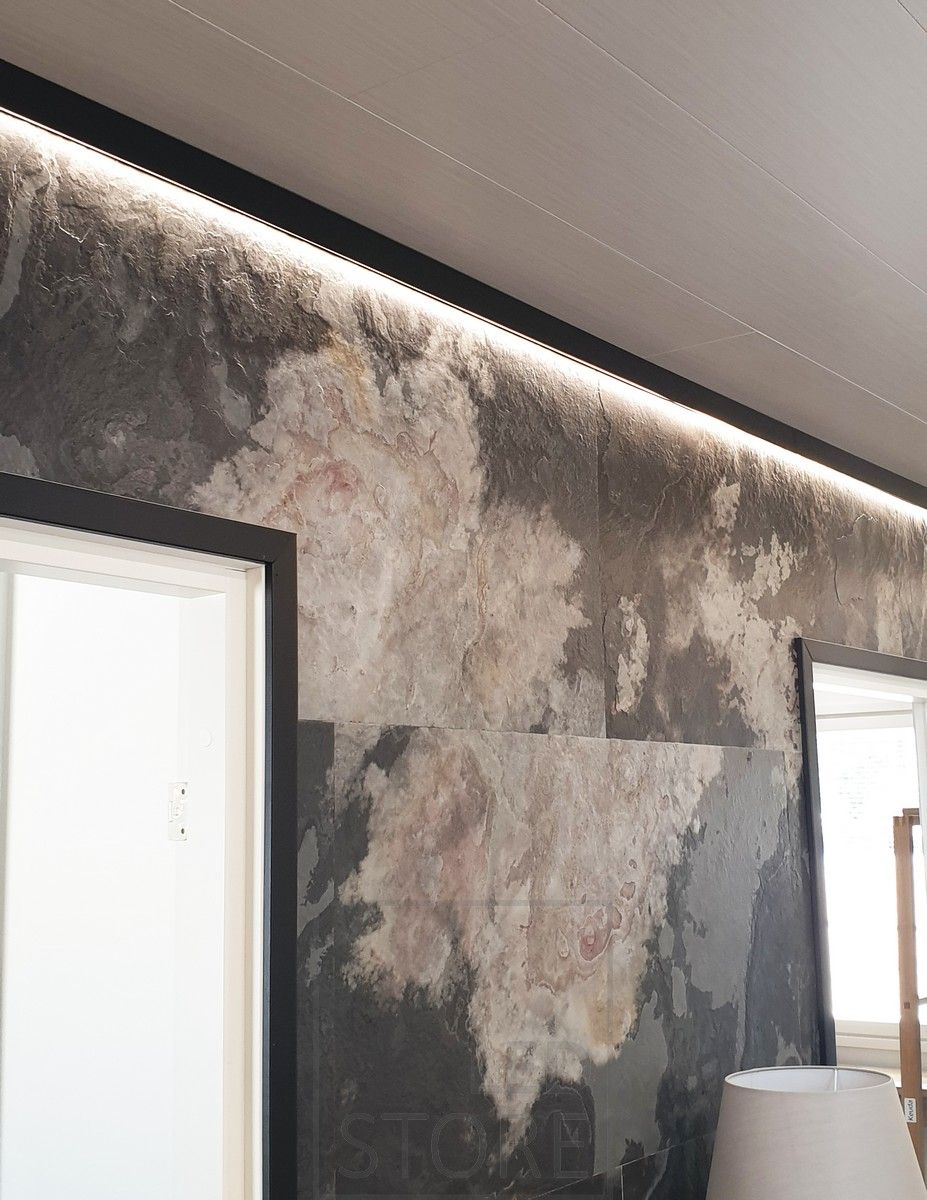 Led ribbon indirectly illuminating and highlighting the wallpaper. The black surface profile replaces the ceiling grid. Ledstore.fi