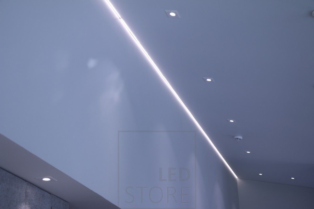 Indirect lighting at the ceiling boundary combined with spot lighting with Kantti spotlights. Ledstore.fi