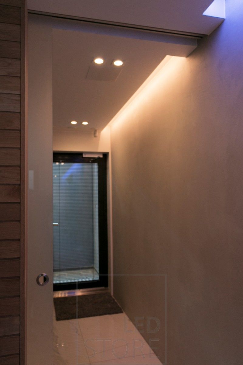 Atmospheric indirect light in a corridor, combined with spotlighting. Ledstore.fi
