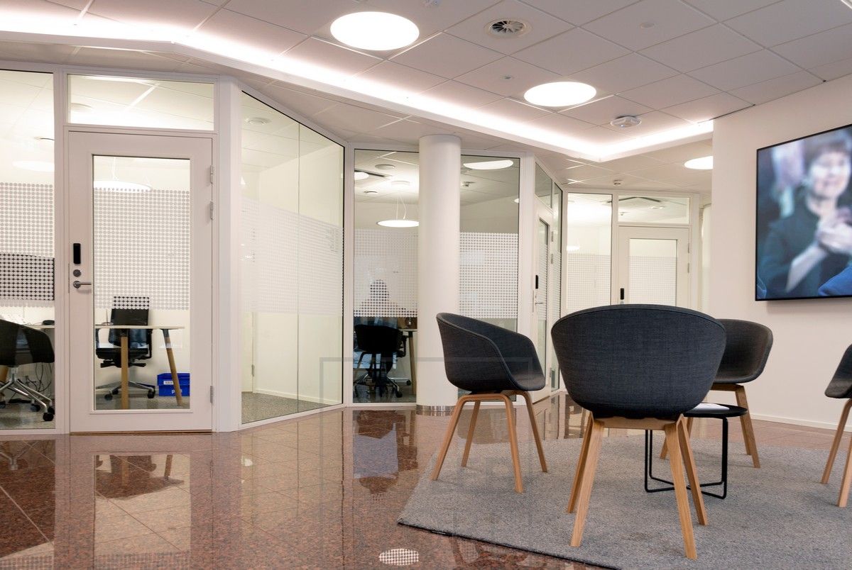 Corridor lighting realized with LED strip in the lowering lip and plafond lamps. Led strip light creating indirect light. General lighting with recessed Plafondi luminaires.