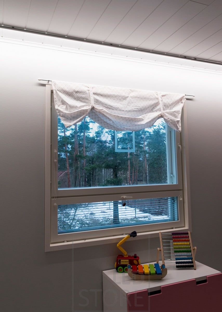 Indirect lighting in a bedroom with a wall-facing led profile. Ledstore.fi