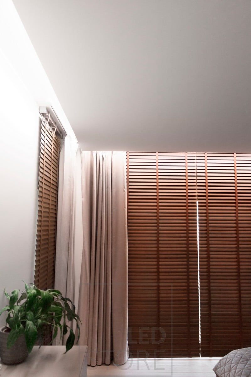 A hotel-like atmosphere was created in a bedroom by installing LED strips indirectly between the ceiling and the wall. The groove was left wide enough to accommodate the curtain rails. Light circulates around the room. Ledstore.fi