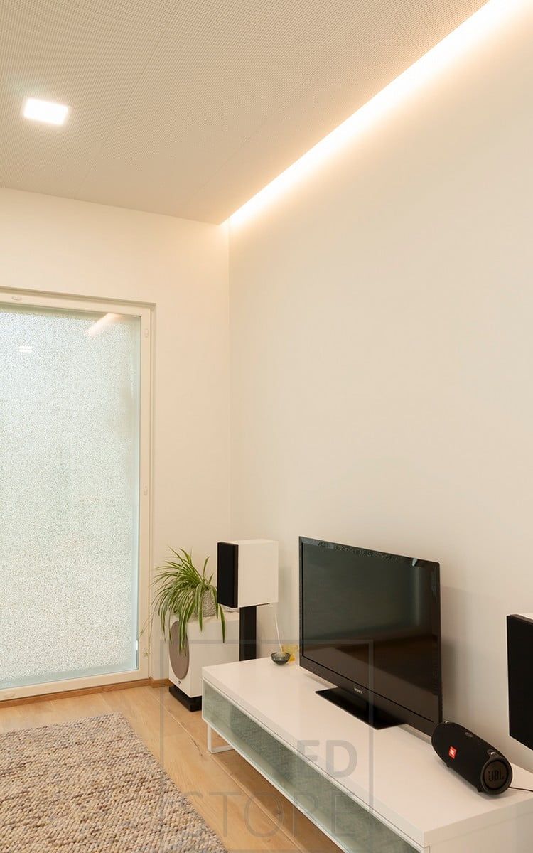 Indirect light above the TV to create mood lighting, led strip between ceiling and wall. Colour temperature adjustable strip. Ledstore.fi