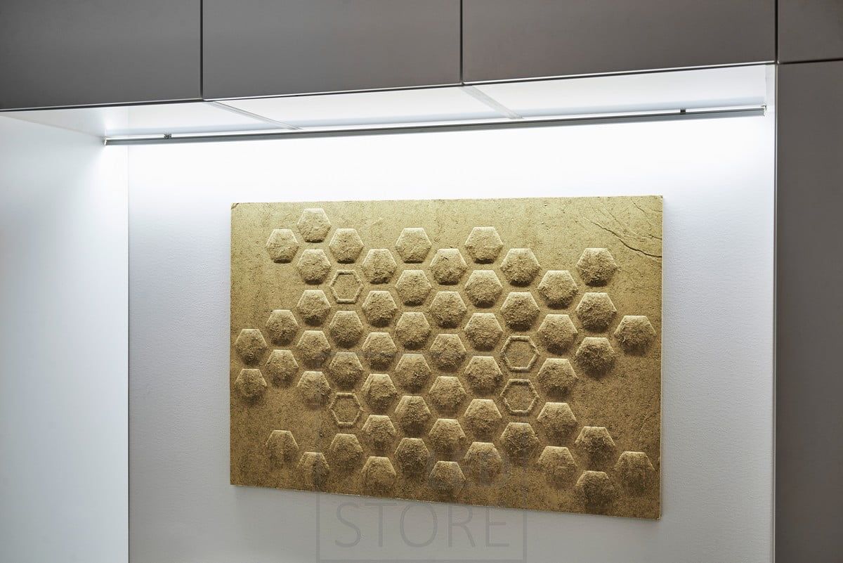 In the bedroom, an LED strip mounted behind the bed, at the base of the wall cupboard, provides atmospheric indirect light. Ledstore.fi