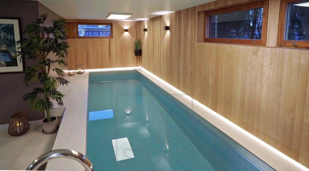 Atmospheric lighting of the pool section is black FUNK wall lamps and behind the beautiful paneling, an LED strip illuminates the floor line. Ledstore.fi
