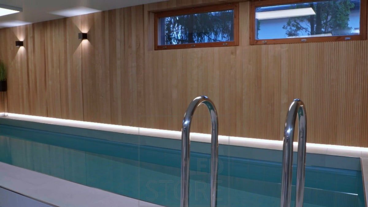 FUNK wall lamps as the atmospheric lighting of the pool area and behind the beautiful paneling, LED strips illuminate the floor line with indirect light. Ledstore.fi