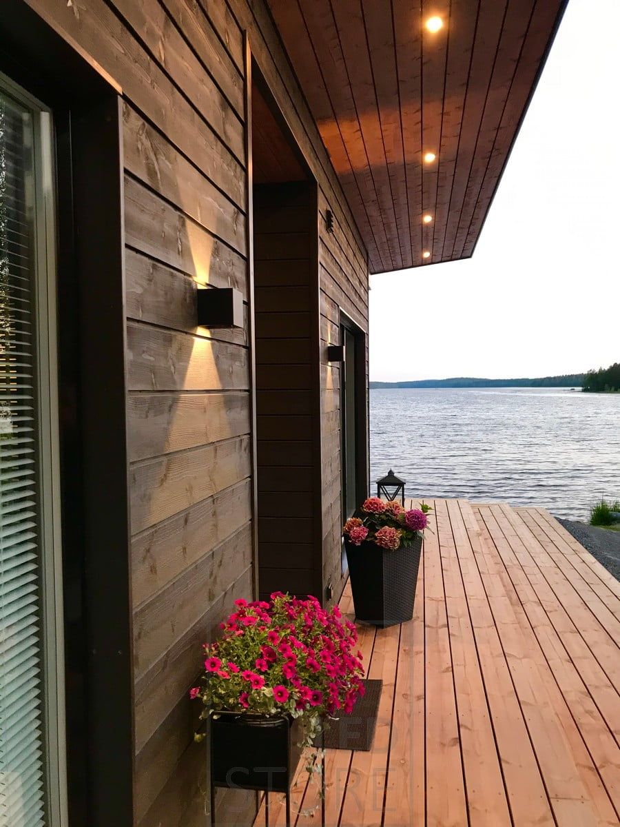 Black FUNK wall lamps accent the facade of the building and provide indirect light. In addition to the FUNK lamps, KANTTI spotlights on the roof of the terrace. Ledstore.fi