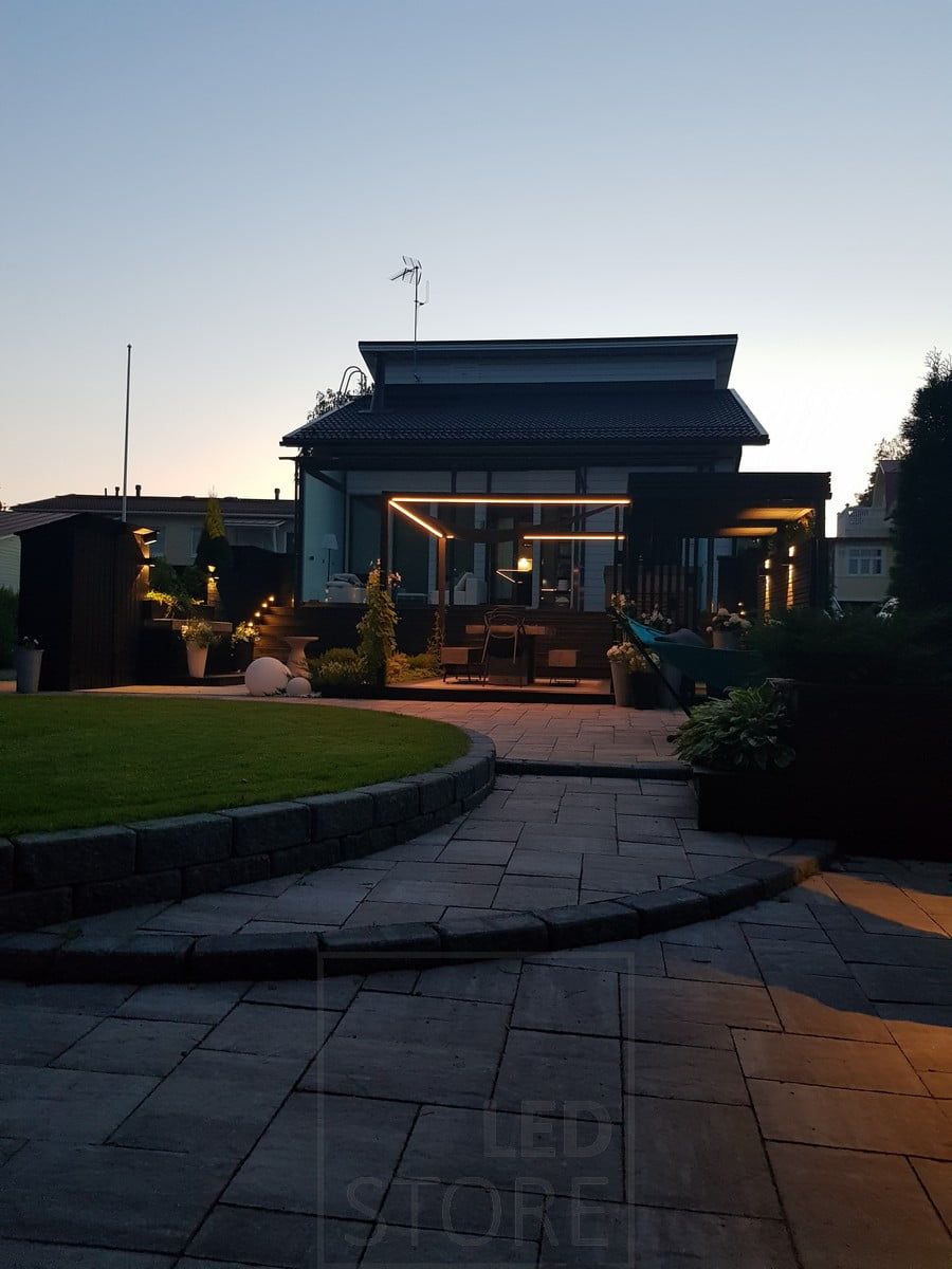 FUNK led Wall light as part of yard lighting. A led strip going around the dining group. Ledstore.fi