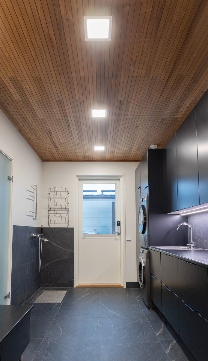 Small led panels as general lighting in the utility room. LED strip illuminates the working level.