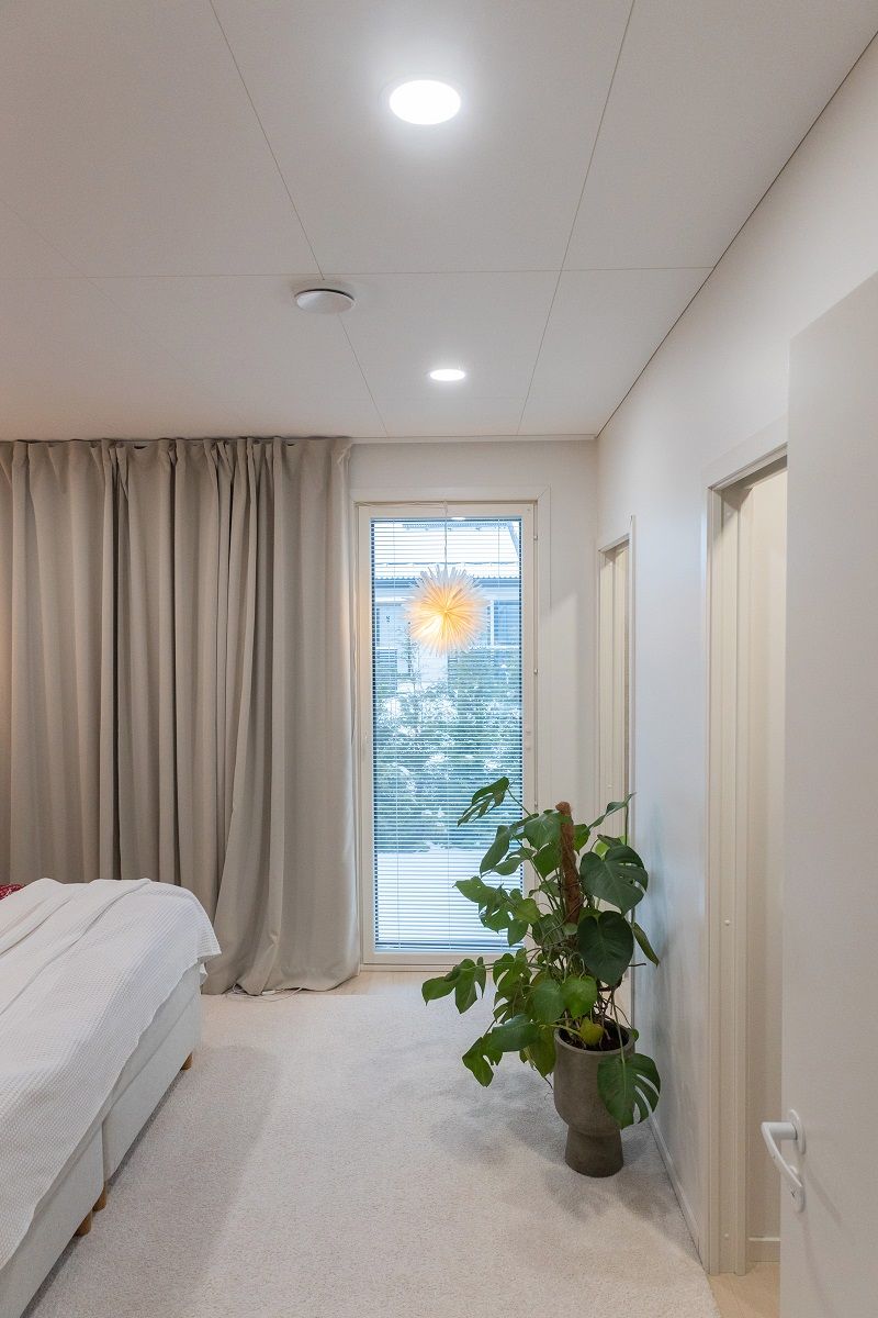 Two round led panels flush mounted in the ceiling.